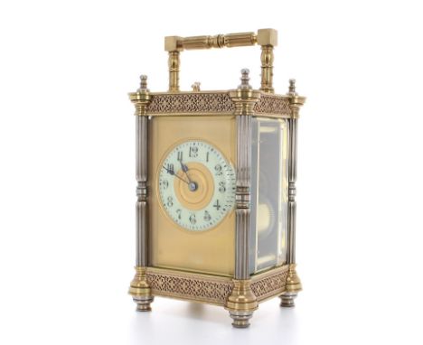 French repeater carriage clock striking on a gong, the 2.25" cream chapter ring within a gilt mask, within an ornate brass an