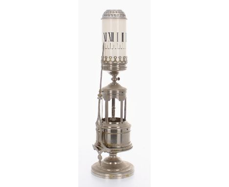Interesting chrome night clock, the cylindrical translucent white glass chapter ring revolving to pass a pointer attached to 