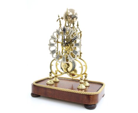 Brass single fusee skeleton mantel clock with passing strike on a bell, the 6.25" pierced silvered chapter ring upon curving 