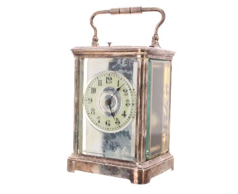 Repeater carriage clock striking on a gong, the 2.5" cream chapter ring within a silvered mirrored mask and silver plated cor