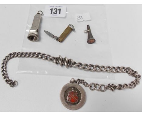 Silver kerb link chain with circular enamel shield pendant, together with a cigar cutter (af) and a watch winder