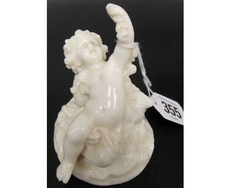 Royal Worcester blanc de chine putti figure reclining on a naturalistic base, impressed mark, height 3.25'