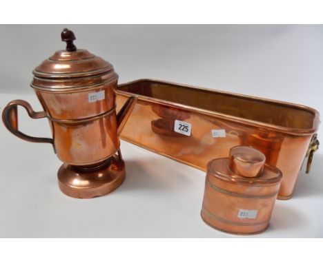 Three items of copper including an oval section tea caddy, coffee percolator and planter with lion ring handles.