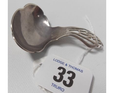 Modern silver caddy spoon with pierced handle and lobed bowl, maker FH, Sheffield 1959.