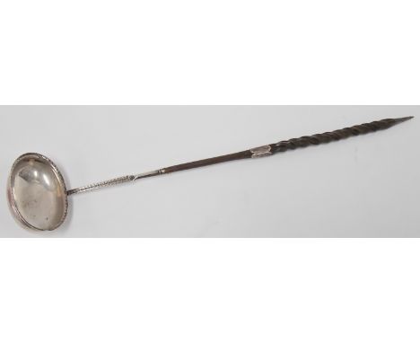 George III silver toddy ladle, the oval bowl with bright cut rim and shaft, the twisted whalebone handle with silver collar a