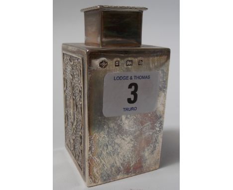 Small silver Victorian square section tea caddy, the square lid with gadrooned border, the body foliate sea scroll embossed t