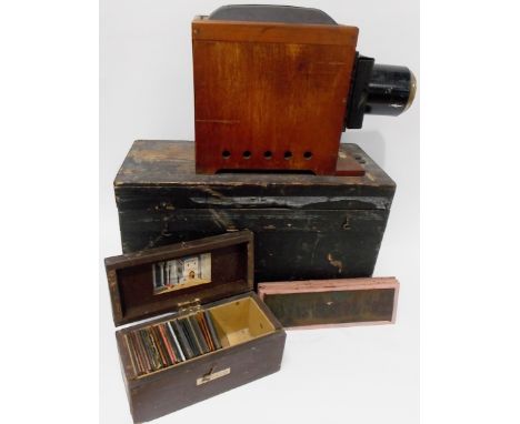 Magic lantern within box, together with a small collection of lantern slides within stained pine box