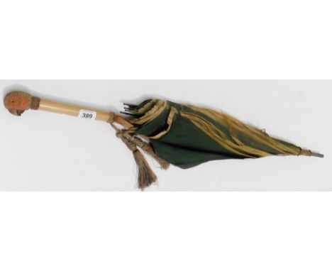 Early 20th Century S Fox & Co paragon parasol, the malacca handle with a parrot head carved and painted knop with glass inset