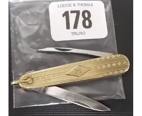 14k gold engine turned pocket knife with stainless steel blade
