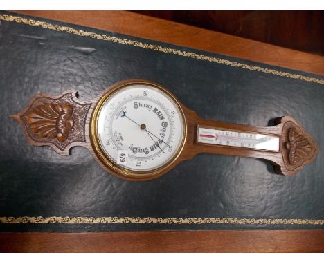 Oak cased aneroid barometer/thermometer.