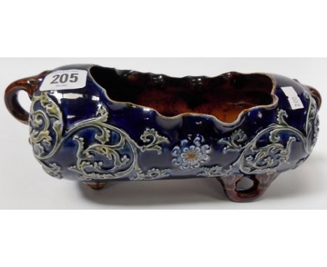Unusual Doulton Lambeth stoneware twin handled planter, of oblong form, decorated in relief with foliate scrolls and daisy he