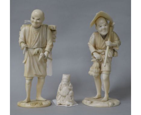 A Japanese Meiji period carved ivory figure of a peasant with axe and pipe, seal mark to base and two other items, including 