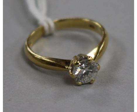 An 18ct gold and solitaire diamond ring, size K.