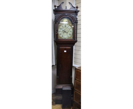 A late 18th century oak and mahogany eight day longcase clock, with painted arched and gilt brass dial