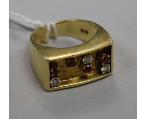 An early 1970's 18ct gold, ruby and diamond set ring, indistinct maker's mark, size K.