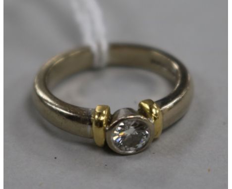 An 18ct gold and collet set solitaire diamond ring, size K.