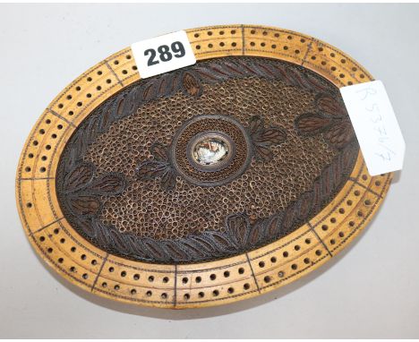 Folk Art. A blonde wood and rolled paper cribbage board