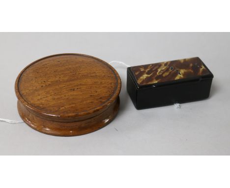A circular turned oak snuff box and a rectangular lacquered snuff box, the oak example reputedly made from timber from the fr