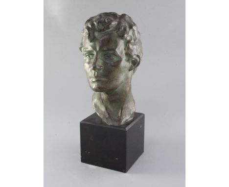 Victor Joseph Ghislain Demanet (1895-1964). A bronze head study of a young man, signed in the bronze, on black marble plinth,