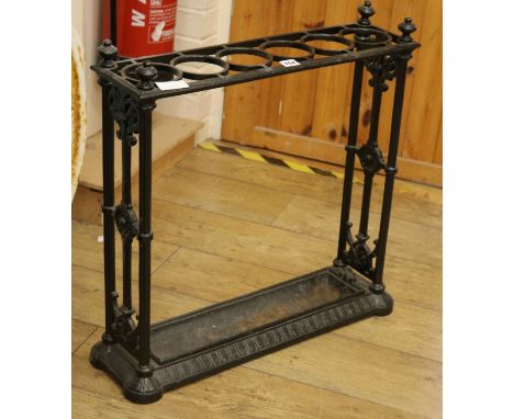 A Victorian cast iron stick and umbrella stand W.64cm