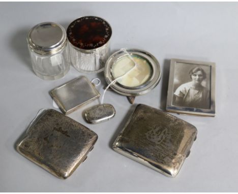 Two silver cigarette cases, an engine-turned match book holder and sundries, including a vesta case, a toilet jar with silver