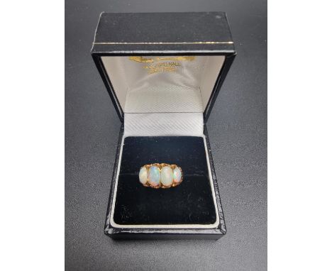 A yellow metal opal ring,&nbsp;size M. 