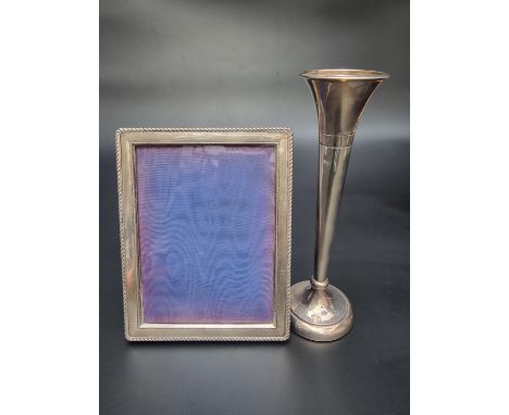 A silver filled stem vase, by A T Cannon Ltd, Birmingham 1980, 21cm high; together with a metal mounted easel photograph fram