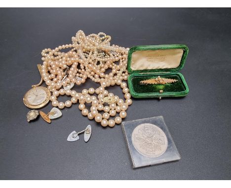 A Victorian yellow metal bar brooch, set seed pearls, 5cm; together with a Timex gold plated manual wind pendant watch and va