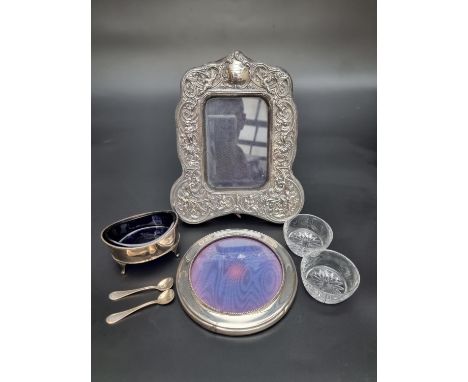 A silver mounted easel photograph frame, London 1979, 22.5cm high; together with another smaller circular example, 14cm diame