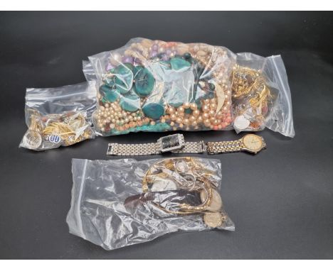 A quantity of costume jewellery and wristwatches. 