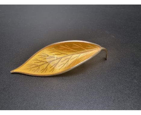 A vintage sterling silver and yellow enamel leaf brooch,&nbsp;by Willy Winnaess for David Andersen, 6.5cm. 