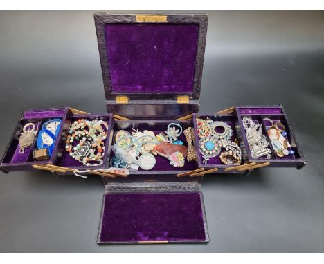 A black leather jewellery case, by J C Vickery, containing costume and other jewellery. 