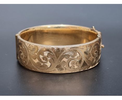 A 9ct rolled gold hinged bangle, by Georg Jensen Ltd. 