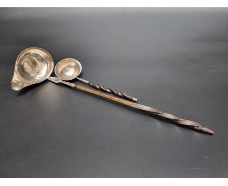 A George III silver ladle having twisted baleen handle, by&nbsp;Josiah Snatt, London 1812, 16cm; together with another larger