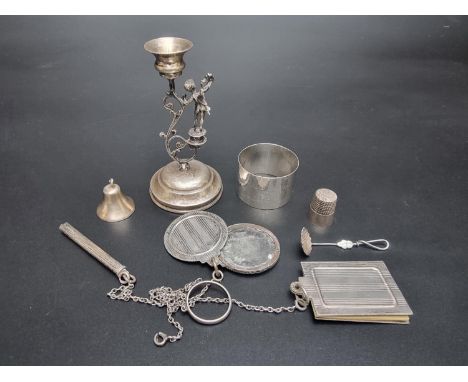 A 19th century Continental candlestick, stamped '800', 9.5cm high; together with a silver napkin ring, a thimble, stamped 'St