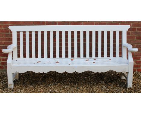 A WHITE PAINTED GARDEN BENCH with slatted back and seat and curved arms, 207cm