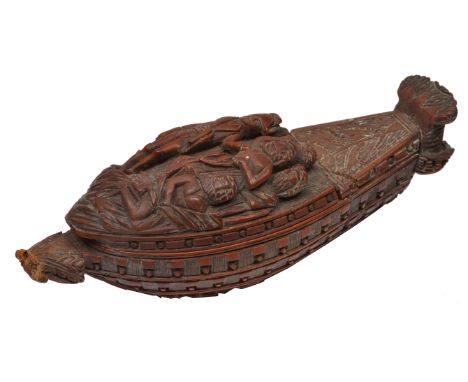 A MID 19TH CENTURY FRENCH COQUILLA NUT CARVED SNUFF BOX in the form of a naval ship with twin gun decks, the lid depicting tw