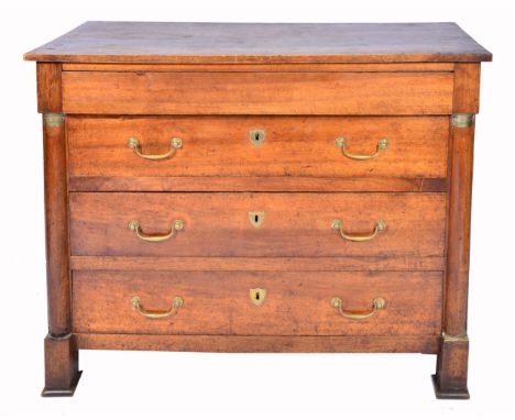A MID 19TH CENTURY WALNUT COMMODE with a long frieze drawer and three long drawers with brass ring handles and flanked by col