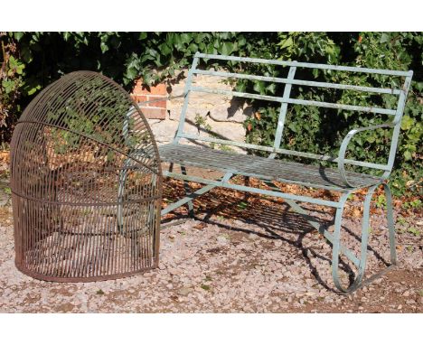 A GREY PAINTED WROUGHT IRON SMALL GARDEN BENCH with curved arms and seat, 123cm; together with an iron domed guard (2)