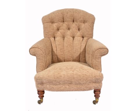 A HOWARD ARMCHAIR with button upholstered back, scrolling arms and bow fronted seat and standing on turned walnut legs termin