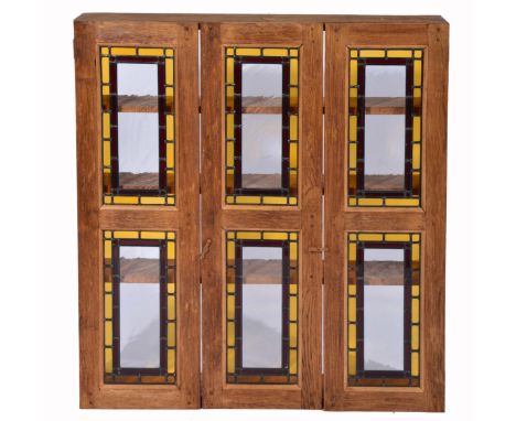 A MID 20TH CENTURY LIMED OAK WALL SHELF, three rows of stained glass panels, 100cm wide together with a late 20th century cab