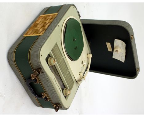 A COMBINATION GRAMOPHONE AND RADIO with a green upholstered and gilt metal fitted case