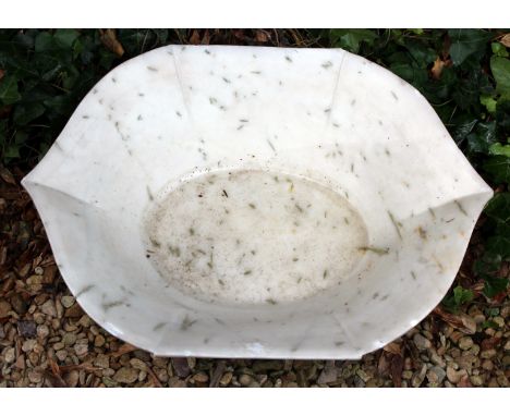 A RAJASTHANI SHALLOW MARBLE BOWL OR BASIN with serpentine outline, 61cm wide x 19cm high 