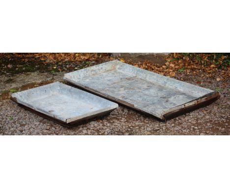 A LARGE 19TH CENTURY RECTANGULAR LEAD AND WOOD FRAMED SALTING TROUGH, 150cm x 74cm together with a smaller lead and wood fram