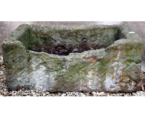 AN OLD RECTANGULAR STONE TROUGH, 90cm wide x 40cm high