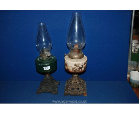 A Brass and Ceramic Oil Lamp with chimney, plus an Oil Lamp with green glass reservoir base decorated with anchors 