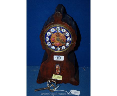 A French Mahogany cased Mantle Clock, with enamelled face, Roman numerals and a small armorial inset, maker Leroy & Fils, Par
