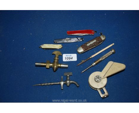 Miscellaneous items including penknives, pipe tamper, small brass tap, champagne tap, etc.