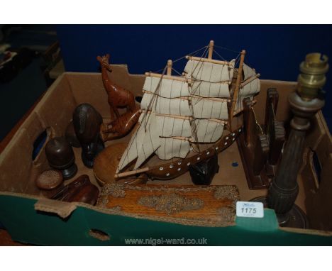 A box of Treen including a turned and reeded table lamp, a pair of art deco picture frames, model boat, two turned lidded bow