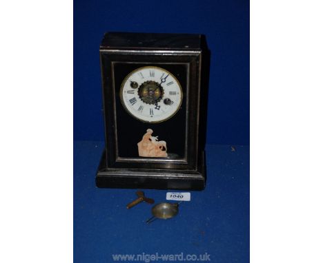 An Ebonised Mantle Clock with gold Aztec decoration, painted glass door by Redstar Company